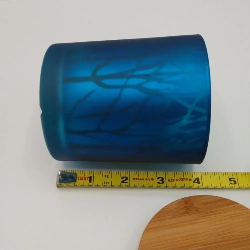 Elegant Blue Glass Candle with Tree Silhouettes